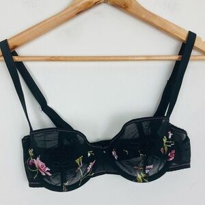 Aubade French luxury balconette bra in sheer black with floral embroidery. 32D